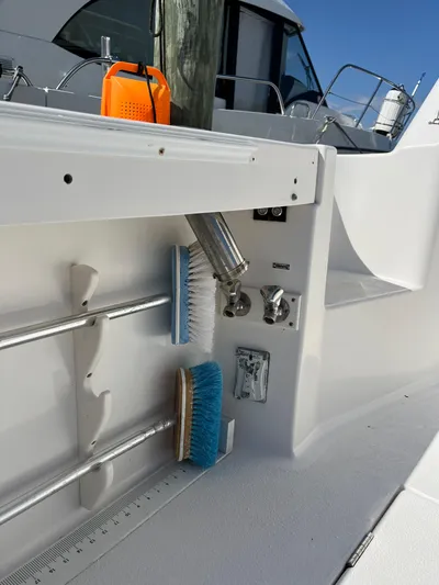  Yacht Photos Pics 2007 Henriques 35 Open boat deck with cleaning brushes and equipment.