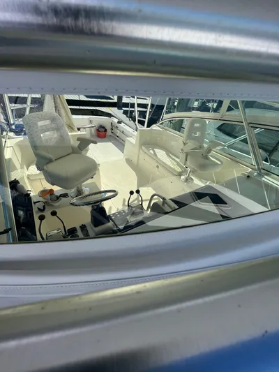  Yacht Photos Pics Interior view of 2007 Henriques 35 Open boat cockpit with seating and controls.