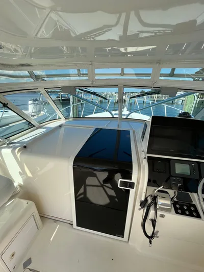  Yacht Photos Pics 2007 Henriques 35 Open boat interior with navigation controls and seating.