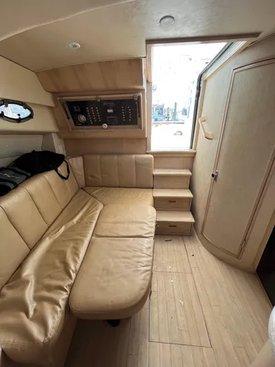  Yacht Photos Pics Interior of 2007 Henriques 35 Open boat with beige seating and wooden flooring.