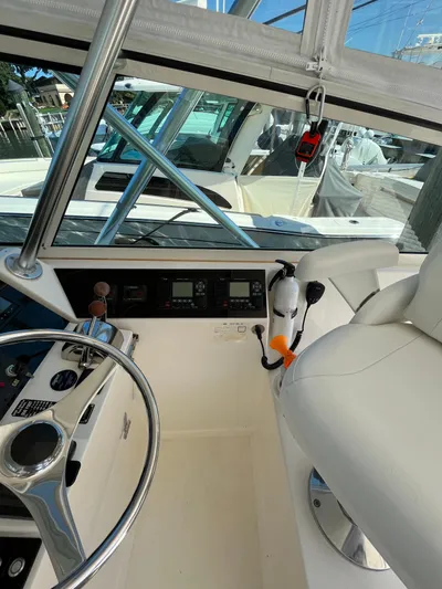  Yacht Photos Pics 2007 Henriques 35 Open boat cockpit with steering wheel and control panel.