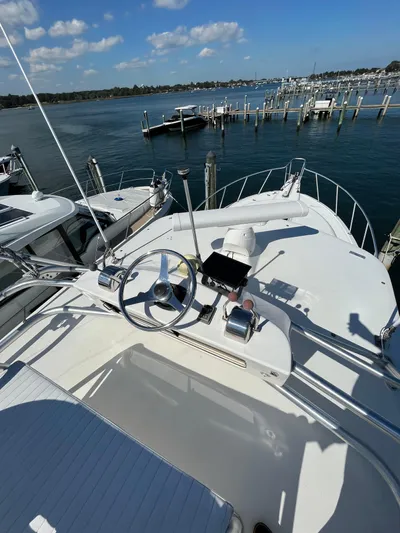  Yacht Photos Pics 2007 Henriques 35 Open boat docked at marina under clear blue sky.