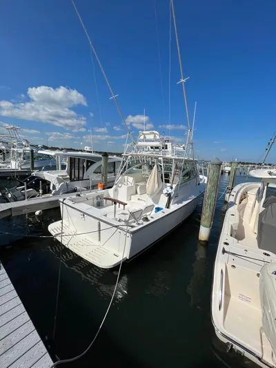  Yacht Photos Pics 2007 Henriques 35 Open boat docked at marina under clear blue sky.