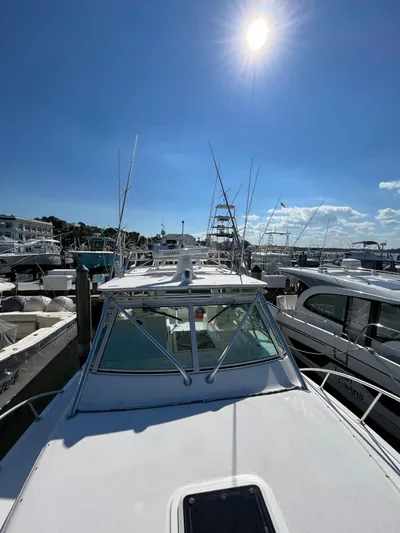  Yacht Photos Pics 2007 Henriques 35 Open boat docked under clear blue sky.