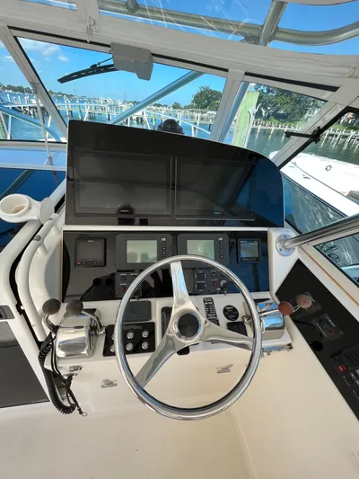  Yacht Photos Pics 2007 Henriques 35 Open boat helm with steering wheel and navigation controls.