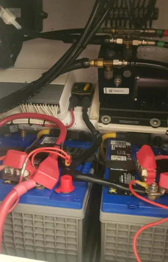  Yacht Photos Pics Battery compartment of a 2017 Invincible 33 Open Fisherman boat with wiring and connections.