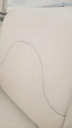  Yacht Photos Pics Close-up of 2017 Invincible 33 Open Fisherman boat seat with white upholstery.