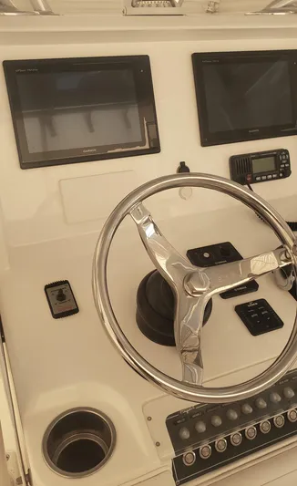  Yacht Photos Pics 2017 Invincible 33 Open Fisherman helm with dual screens and steering wheel.