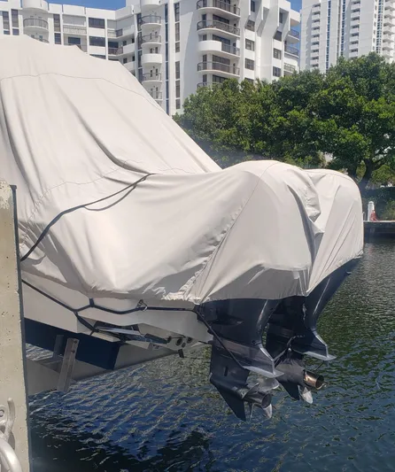  Yacht Photos Pics Covered 2017 Invincible 33 Open Fisherman boat docked near waterfront buildings.