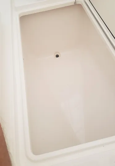  Yacht Photos Pics 2017 Invincible 33 Open Fisherman boat storage compartment, clean and spacious design.