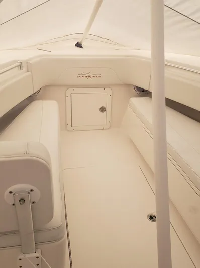  Yacht Photos Pics 2017 Invincible 33 Open Fisherman boat interior with white seating and storage.
