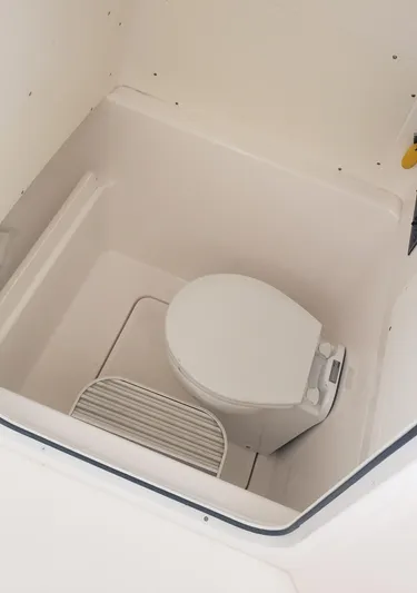  Yacht Photos Pics 2017 Invincible 33 Open Fisherman boat toilet compartment, white interior.