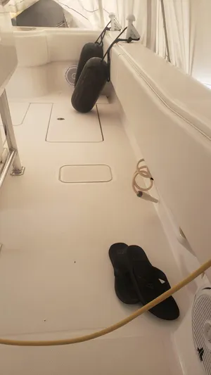  Yacht Photos Pics 2017 Invincible 33 Open Fisherman boat deck with fenders and flip-flops.