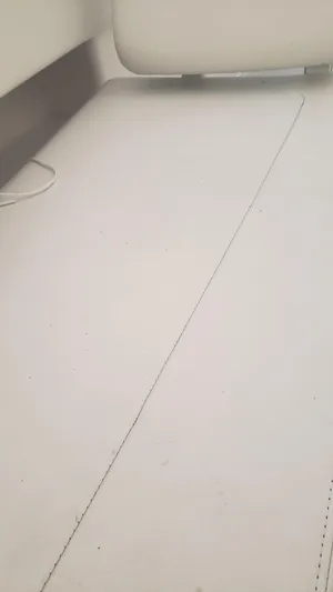  Yacht Photos Pics 2017 Invincible 33 Open Fisherman interior detail, featuring clean white upholstery.