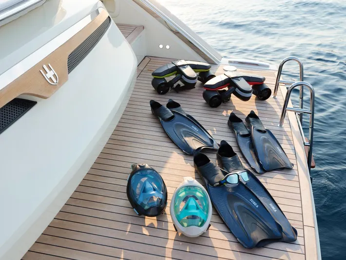  Yacht Photos Pics Snorkeling gear on Invictus TT460 yacht deck, 2023 model, near water.