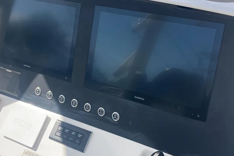 Storm Gray Yacht Photos Pics 2024 Regulator 30XO boat dashboard with Garmin displays and Yamaha controls.