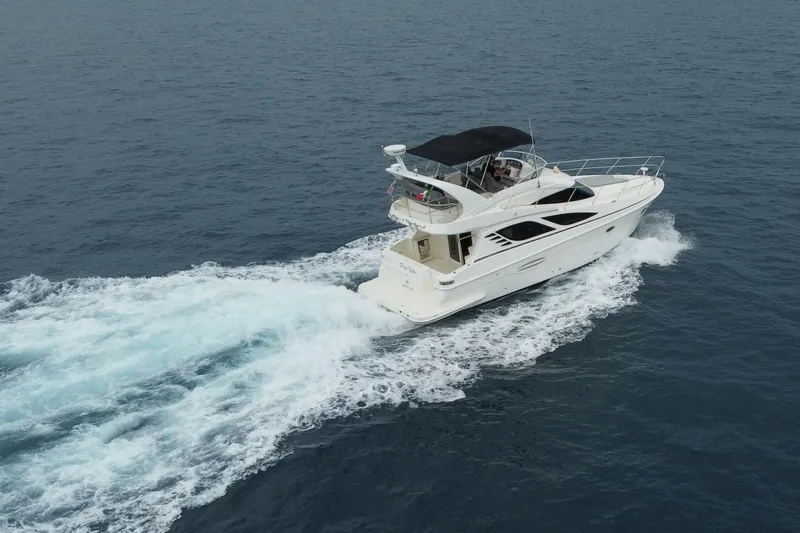Pura Vida Yacht Photos Pics 2010 Silverton 38 Sedan Bridge cruising on open water.
