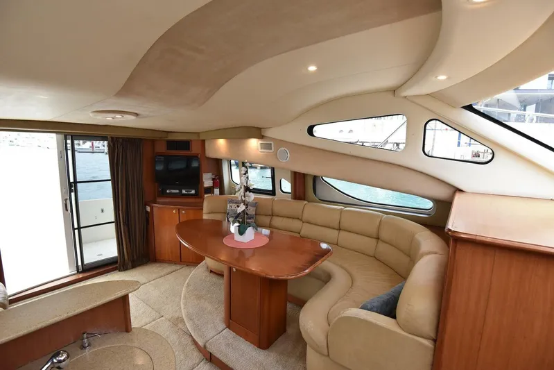 Pura Vida Yacht Photos Pics Luxurious interior of 2010 Silverton 38 Sedan Bridge yacht with plush seating and elegant design.