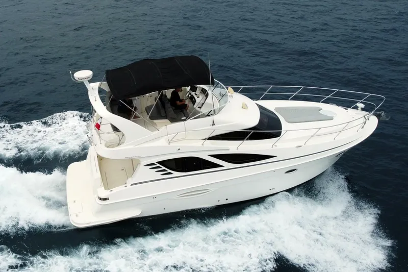 Pura Vida Yacht Photos Pics 2010 Silverton 38 Sedan Bridge yacht cruising on open water.