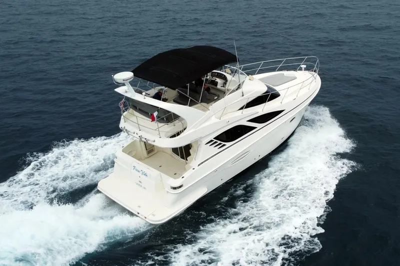 Pura Vida Yacht Photos Pics 2010 Silverton 38 Sedan Bridge yacht cruising on open water.