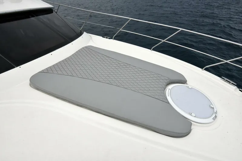 Pura Vida Yacht Photos Pics 2010 Silverton 38 Sedan Bridge yacht with cushioned deck and ocean view.