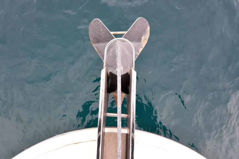 Pura Vida Yacht Photos Pics Anchor of 2010 Silverton 38 Sedan Bridge over calm blue water.