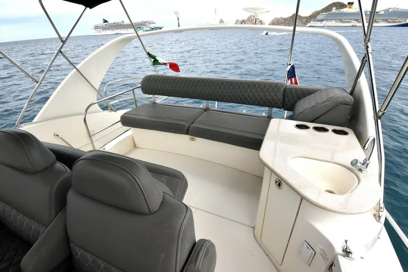 Pura Vida Yacht Photos Pics 2010 Silverton 38 Sedan Bridge yacht interior with seating and sink, ocean view.