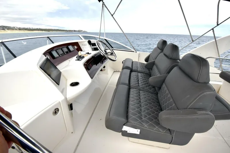 Pura Vida Yacht Photos Pics 2010 Silverton 38 Sedan Bridge yacht interior with luxurious seating and modern dashboard.