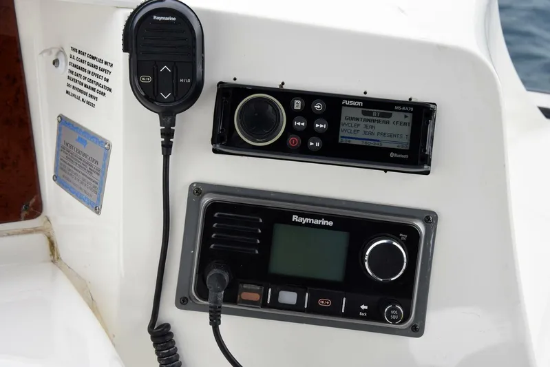 Pura Vida Yacht Photos Pics Control panel of a 2010 Silverton 38 Sedan Bridge with Raymarine and Fusion systems.