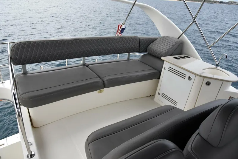 Pura Vida Yacht Photos Pics 2010 Silverton 38 Sedan Bridge interior with gray seating and ocean view.
