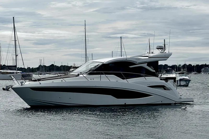  Yacht Photos Pics 2023 Galeon 425 HTS yacht on calm water, surrounded by sailboats.