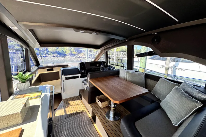  Yacht Photos Pics Luxurious interior of 2023 Galeon 425 HTS yacht with elegant seating and wooden table.