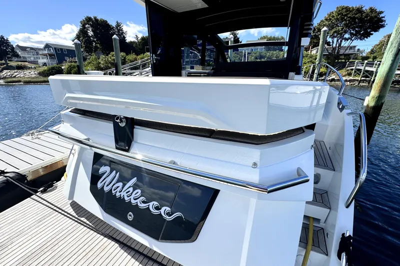  Yacht Photos Pics 2023 Galeon 425 HTS yacht docked, rear view with "Wakecoo" nameplate, sunny day.