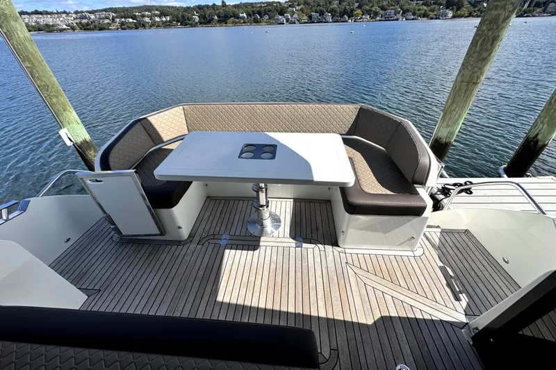  Yacht Photos Pics Luxurious seating area on 2023 Galeon 425 HTS yacht, overlooking serene waterfront.