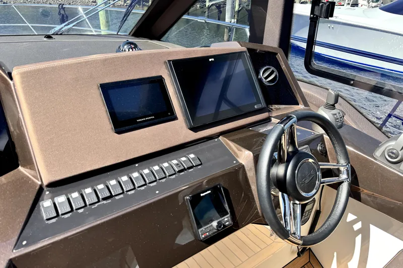  Yacht Photos Pics 2023 Galeon 425 HTS helm with modern controls and dual screens.