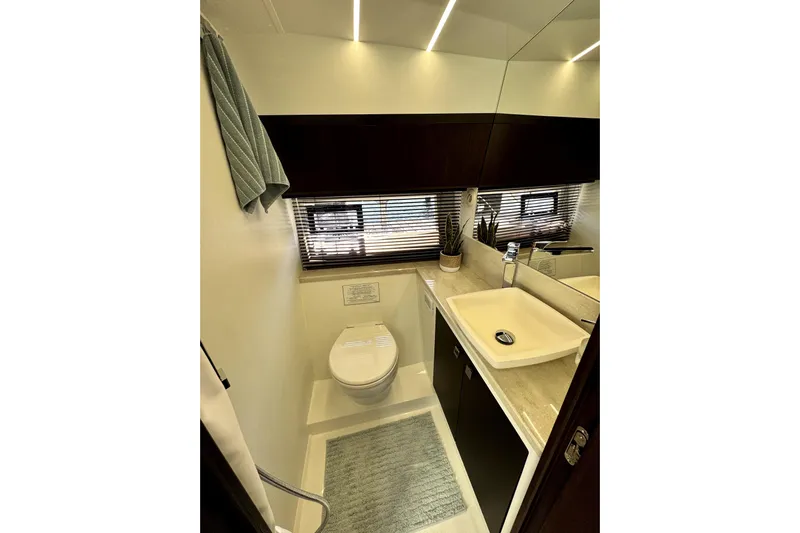  Yacht Photos Pics Luxurious bathroom in 2023 Galeon 425 HTS yacht with modern fixtures and elegant design.
