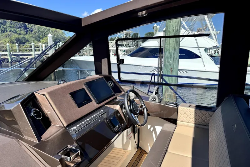  Yacht Photos Pics Interior view of 2023 Galeon 425 HTS yacht cockpit with modern controls and luxurious seating.