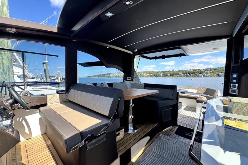  Yacht Photos Pics 2023 Galeon 425 HTS yacht interior with elegant seating and scenic waterfront view.