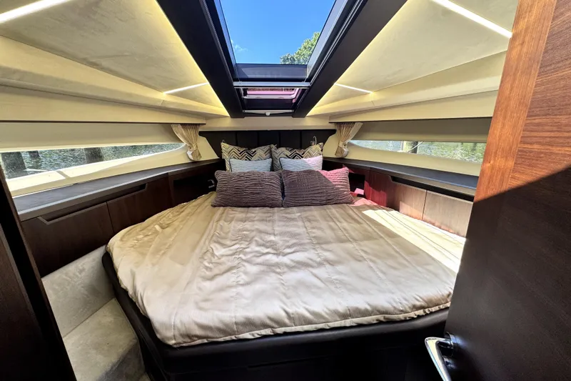  Yacht Photos Pics Luxurious bedroom interior of 2023 Galeon 425 HTS yacht with skylight and elegant bedding.