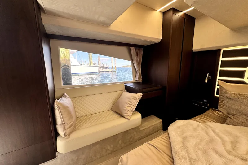  Yacht Photos Pics Luxurious interior of 2023 Galeon 425 HTS yacht with elegant seating and window view.