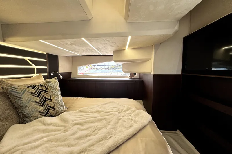  Yacht Photos Pics Luxurious interior cabin of 2023 Galeon 425 HTS yacht with modern bedding and window view.
