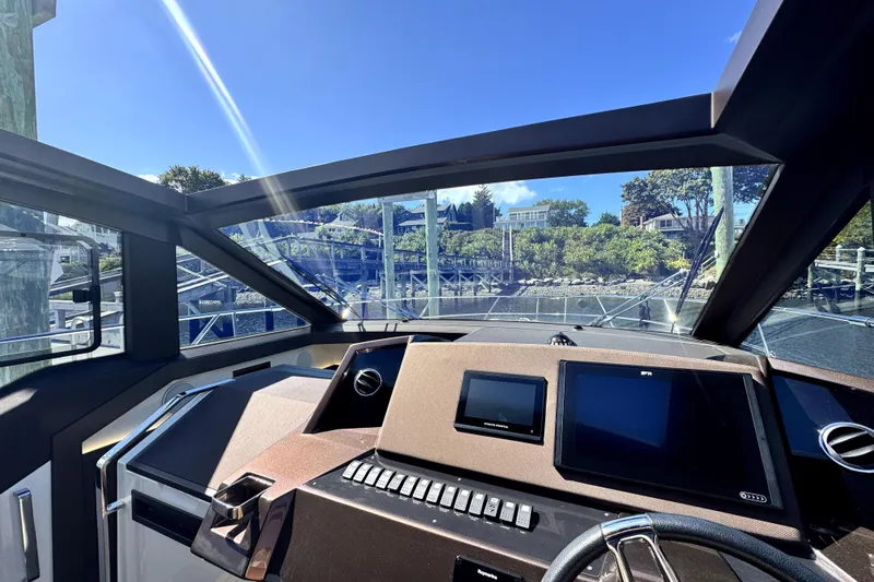  Yacht Photos Pics Interior view of 2023 Galeon 425 HTS yacht cockpit with modern navigation displays.