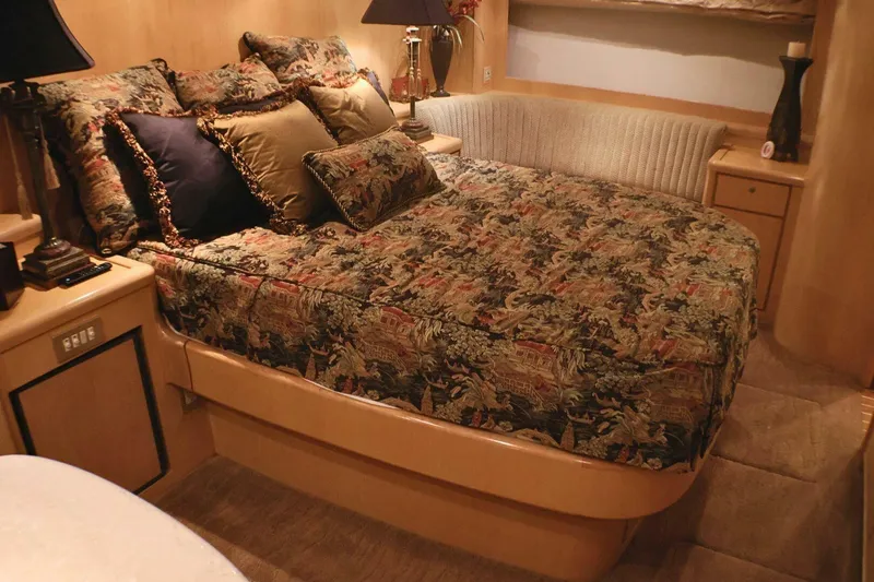  Yacht Photos Pics Luxurious bedroom interior of 2001 Donzi 73 Sport Yacht with elegant bedding and decor.