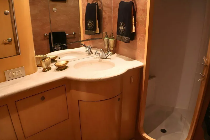  Yacht Photos Pics Luxurious bathroom in 2001 Donzi 73 Sport Yacht with dual sinks and elegant decor.