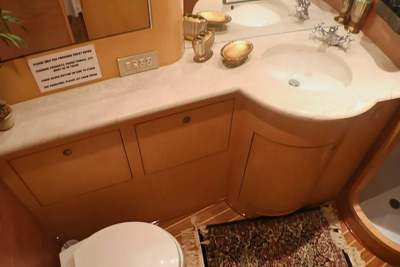  Yacht Photos Pics Luxurious bathroom interior of 2001 Donzi 73 Sport Yacht with elegant fixtures and decor.