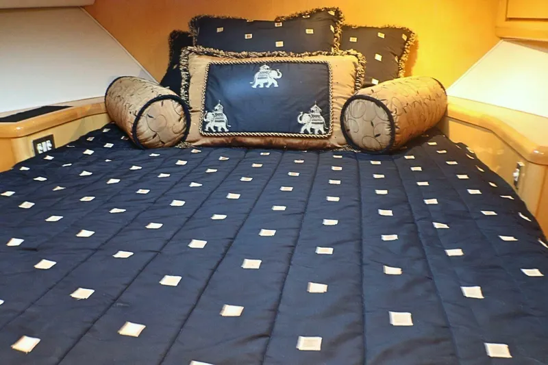  Yacht Photos Pics Luxurious bedroom interior of 2001 Donzi 73 Sport Yacht with elegant bedding and cushions.