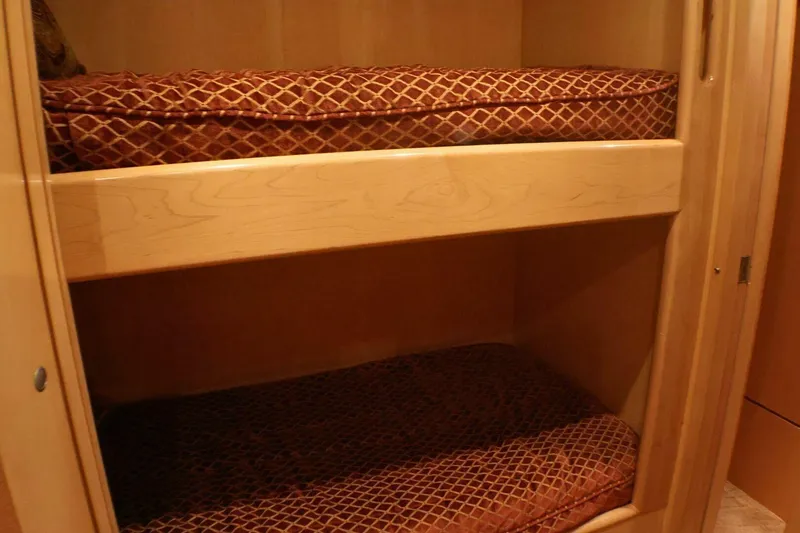  Yacht Photos Pics Bunk beds with patterned cushions in 2001 Donzi 73 Sport Yacht interior.
