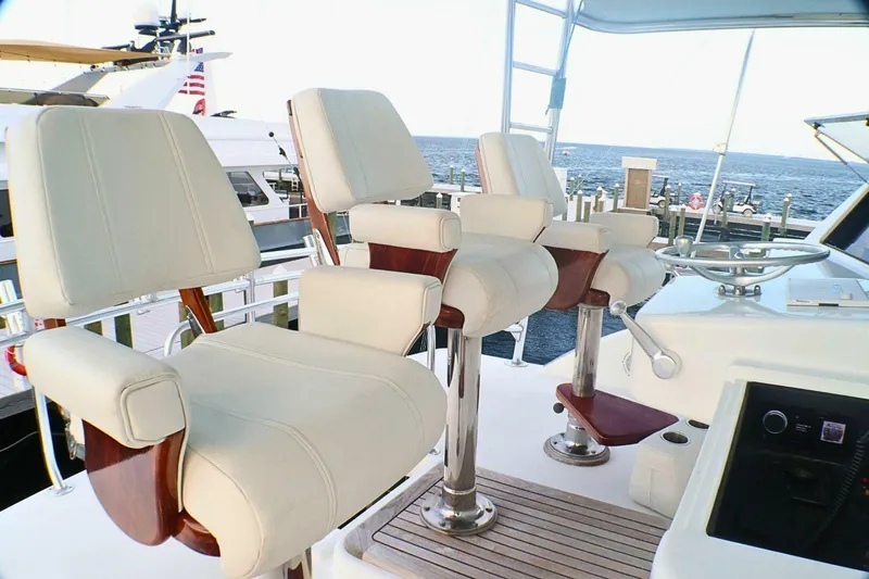  Yacht Photos Pics Luxury helm seating on 2001 Donzi 73 Sport Yacht, overlooking marina and ocean.