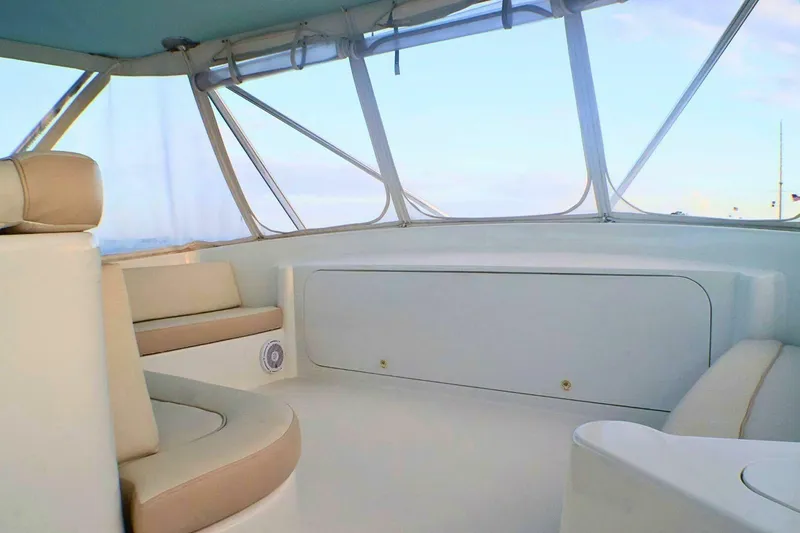  Yacht Photos Pics Interior of 2001 Donzi 73 Sport Yacht with beige seating and panoramic windows.