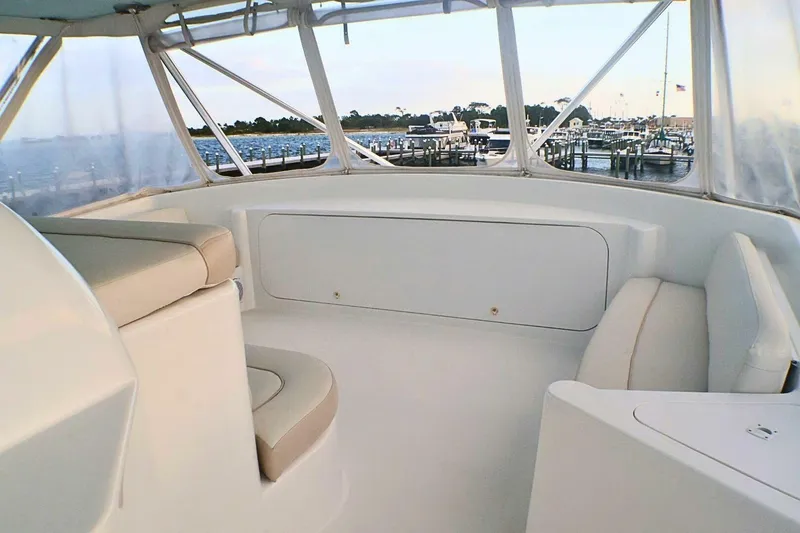  Yacht Photos Pics 2001 Donzi 73 Sport Yacht interior with beige seating, overlooking marina.